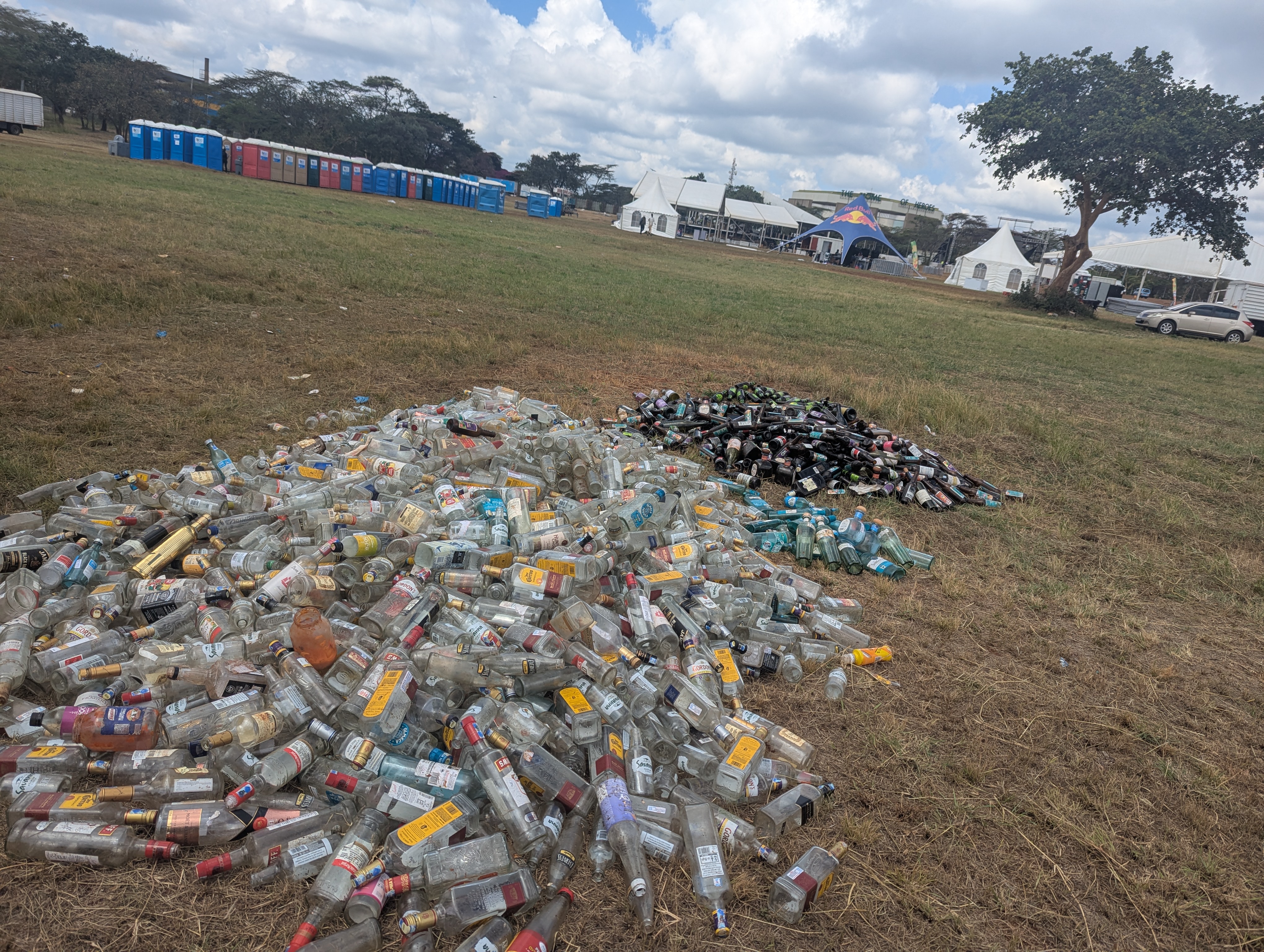A pile of glass bottles separated by colour at a Nairobi festival.